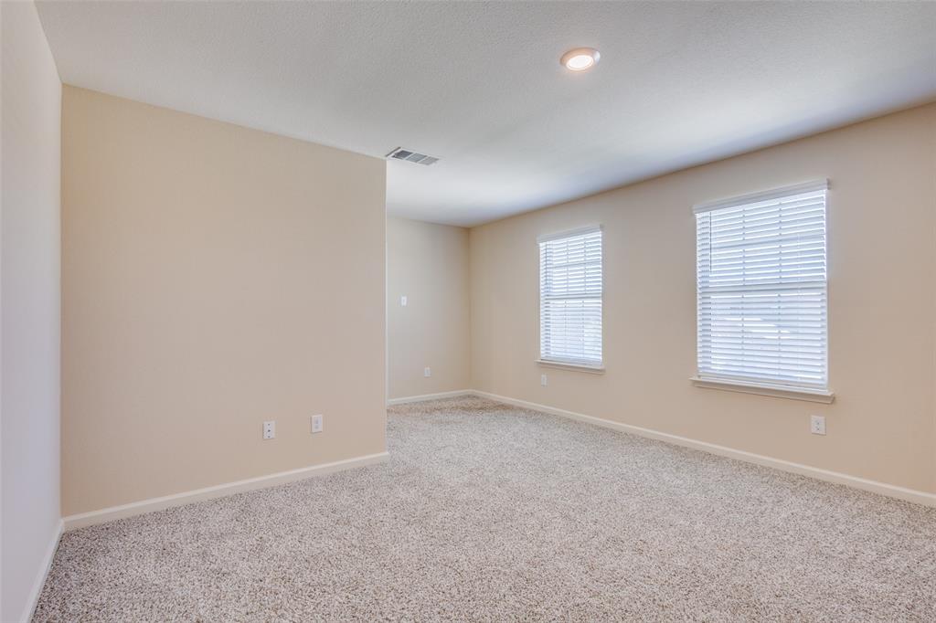 2256 Cashmere Way Princeton, TX 75407 - Photo 25 of 36 an empty room with windows