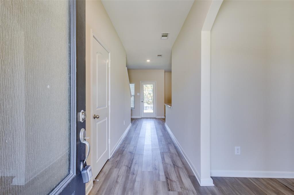 2256 Cashmere Way Princeton, TX 75407 - Photo 5 of 36 a view of a hallway with wooden floor
