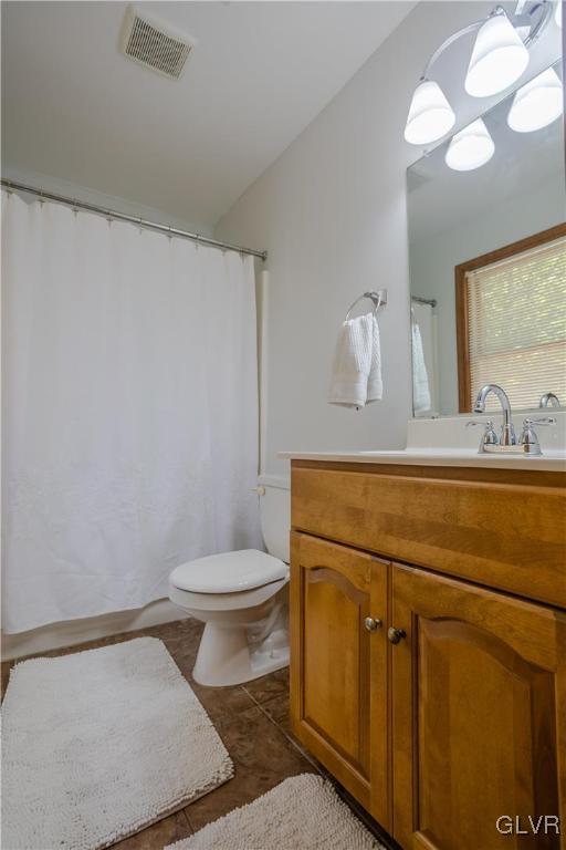 3348 Oberon Road Tobyhanna, PA 18466 - Photo 13 of 22 a bathroom with a granite countertop sink a toilet and a mirror