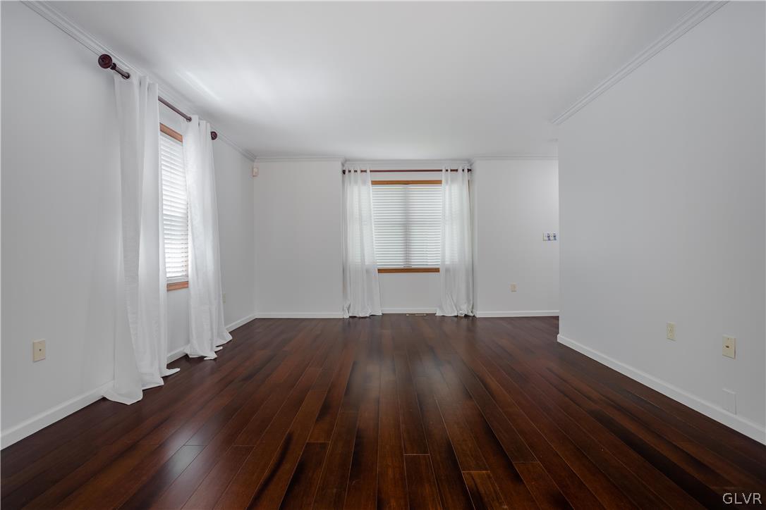3348 Oberon Road Tobyhanna, PA 18466 - Photo 4 of 22 an empty room with wooden floor and windows