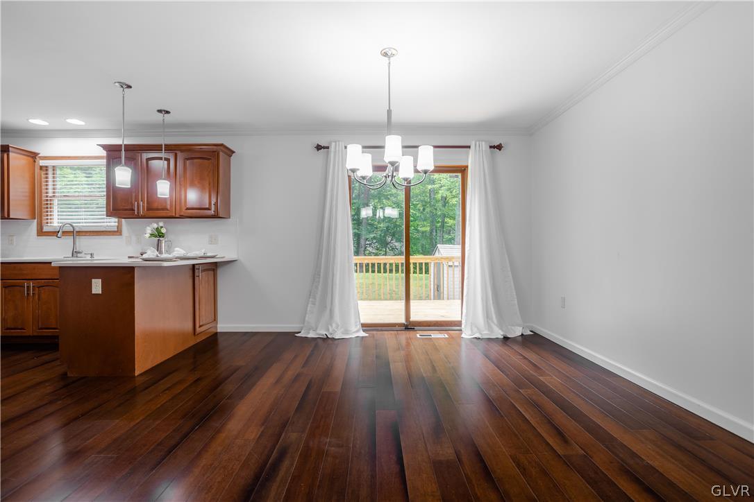 3348 Oberon Road Tobyhanna, PA 18466 - Photo 5 of 22 a open kitchen with wooden floor and window