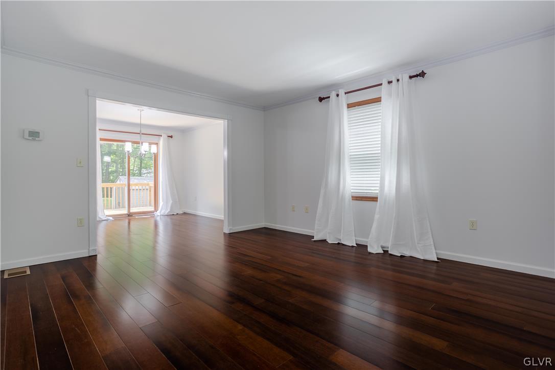 3348 Oberon Road Tobyhanna, PA 18466 - Photo 6 of 22 a view of an empty room with wooden floor and a window