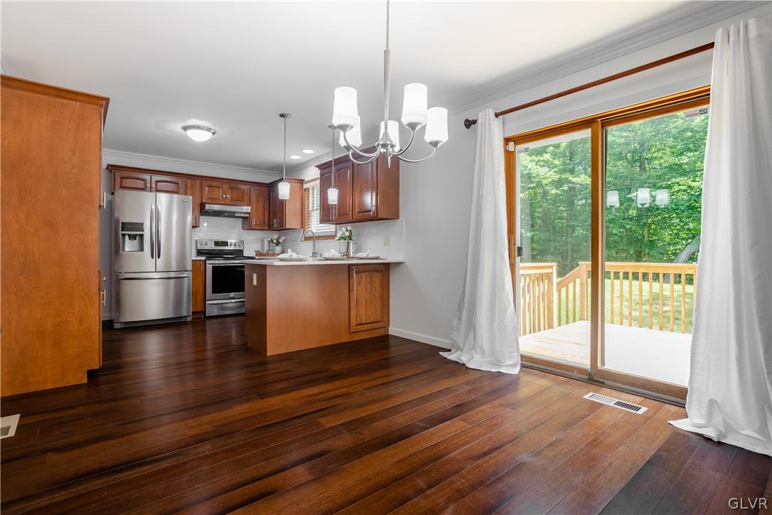 3348 Oberon Road Tobyhanna, PA 18466 - Photo 7 of 22 a view of a kitchen with wooden floor and a kitchen