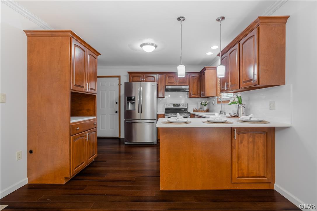 3348 Oberon Road Tobyhanna, PA 18466 - Photo 8 of 22 a kitchen with stainless steel appliances granite countertop a refrigerator a sink dishwasher a oven with wooden cabinets and floor
