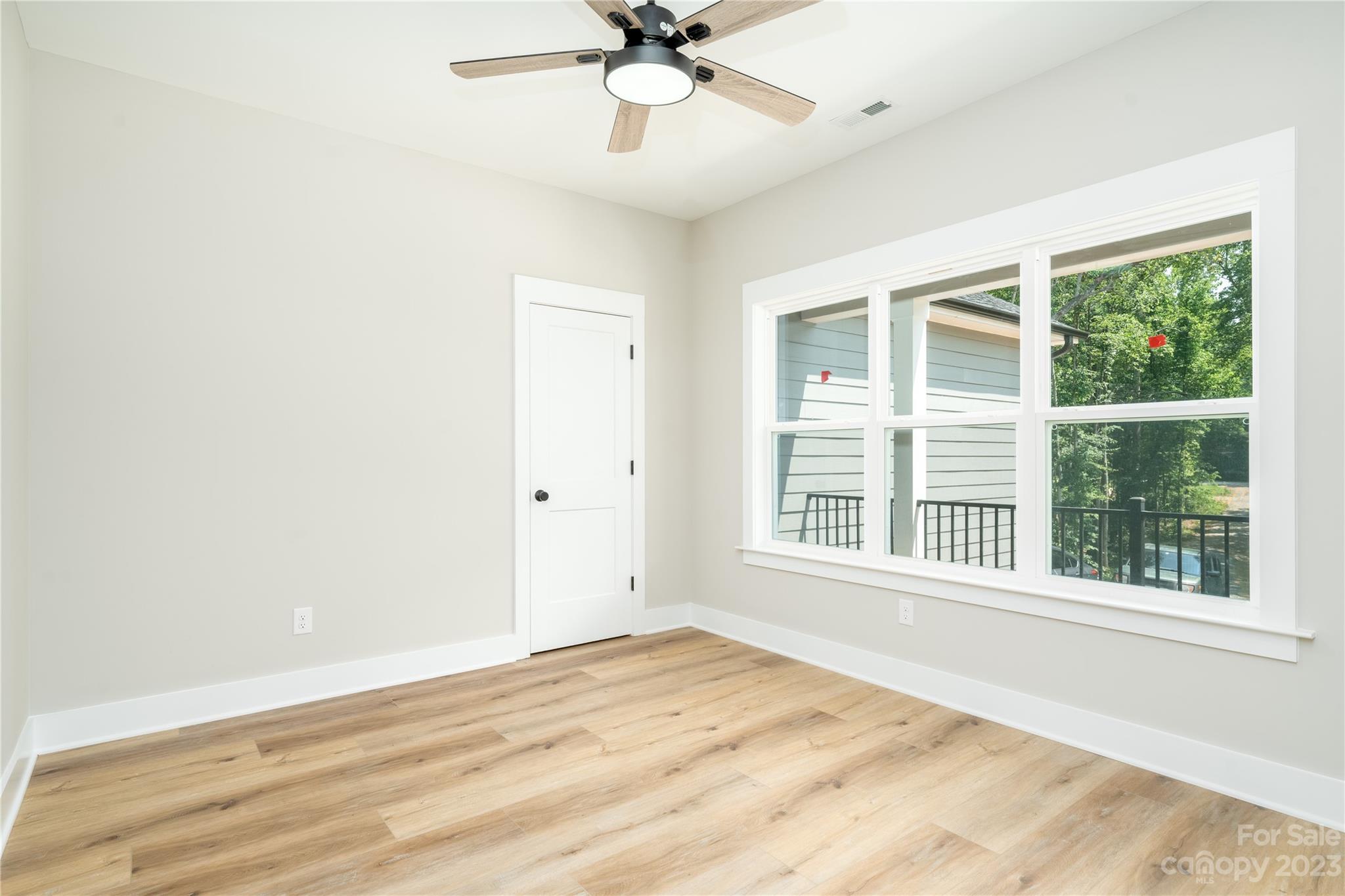2512 Shuford Road, Unit 7A Lincolnton, NC 28092 - Photo 15 of 27 a view of an empty room with a window and a ceiling fan