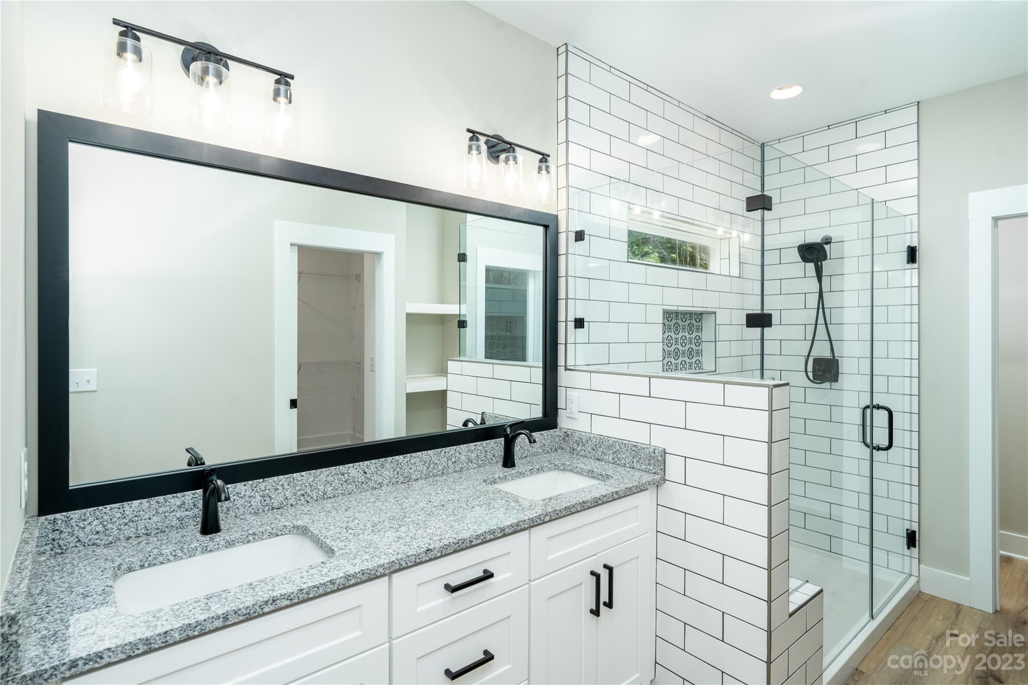 2512 Shuford Road, Unit 7A Lincolnton, NC 28092 - Photo 16 of 27 a bathroom with a granite countertop sink and a mirror