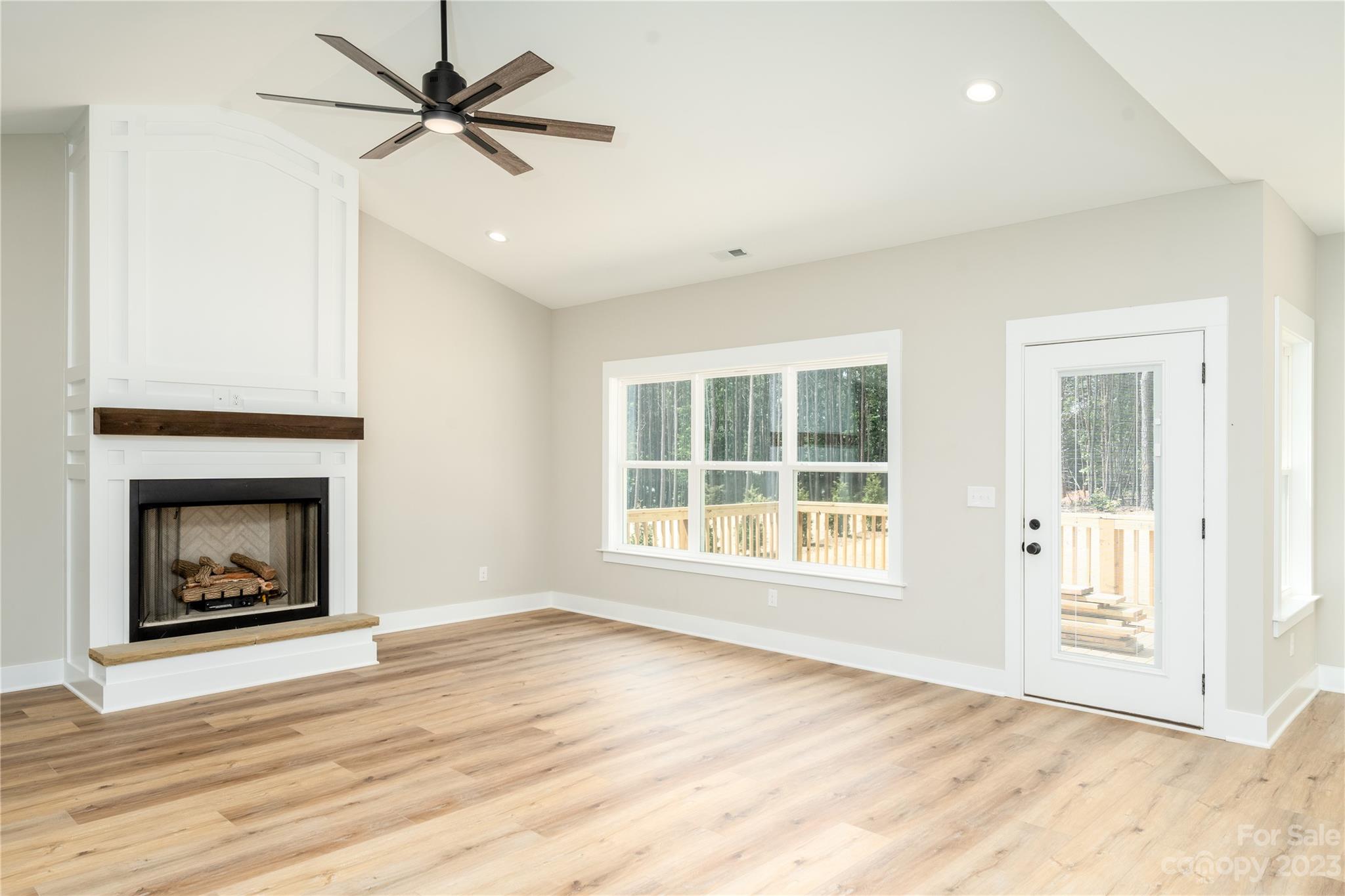 2512 Shuford Road, Unit 7A Lincolnton, NC 28092 - Photo 2 of 27 a view of an empty room with a window and a fireplace