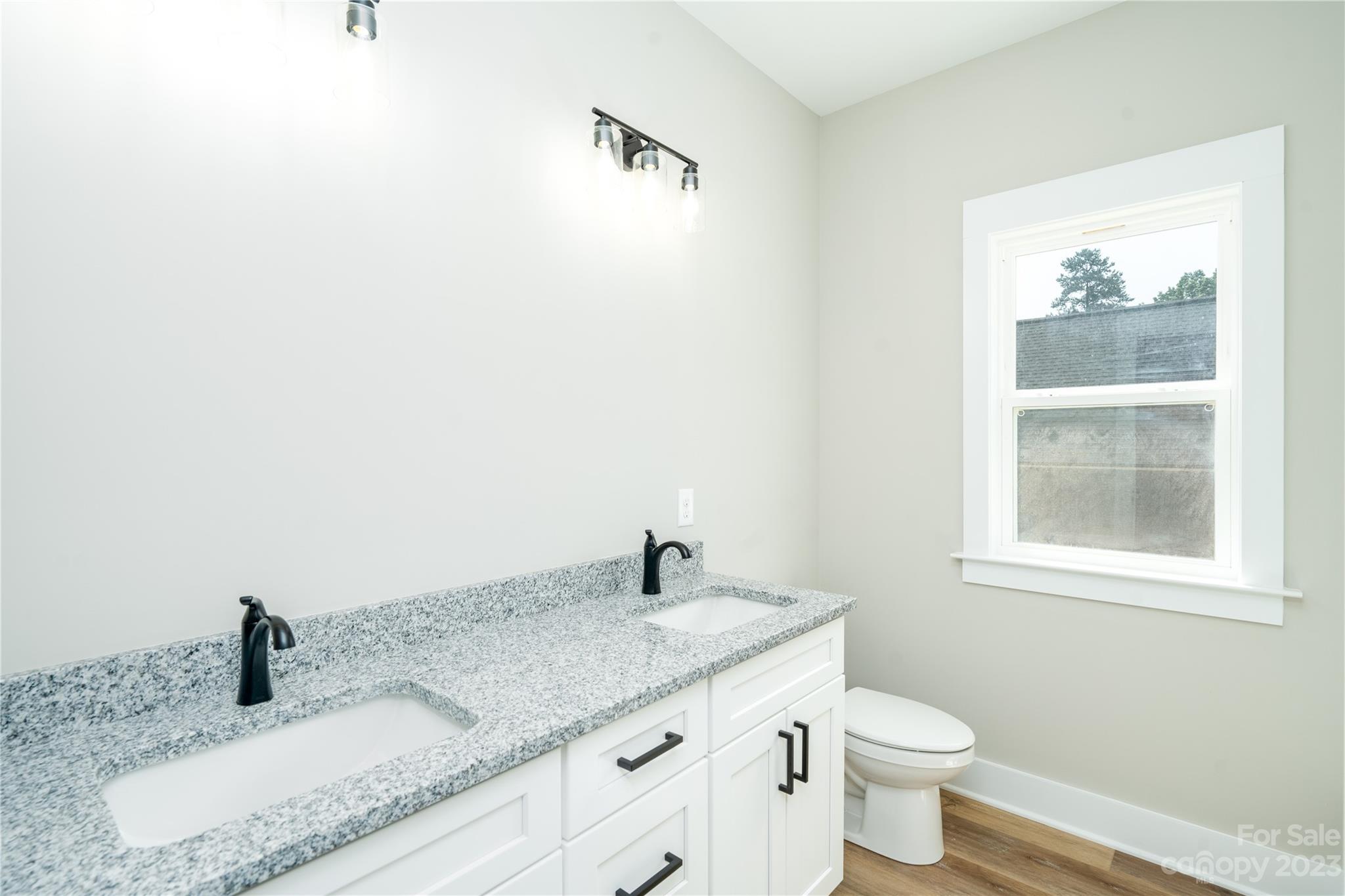 2512 Shuford Road, Unit 7A Lincolnton, NC 28092 - Photo 21 of 27 a bathroom with a granite countertop sink and a mirror