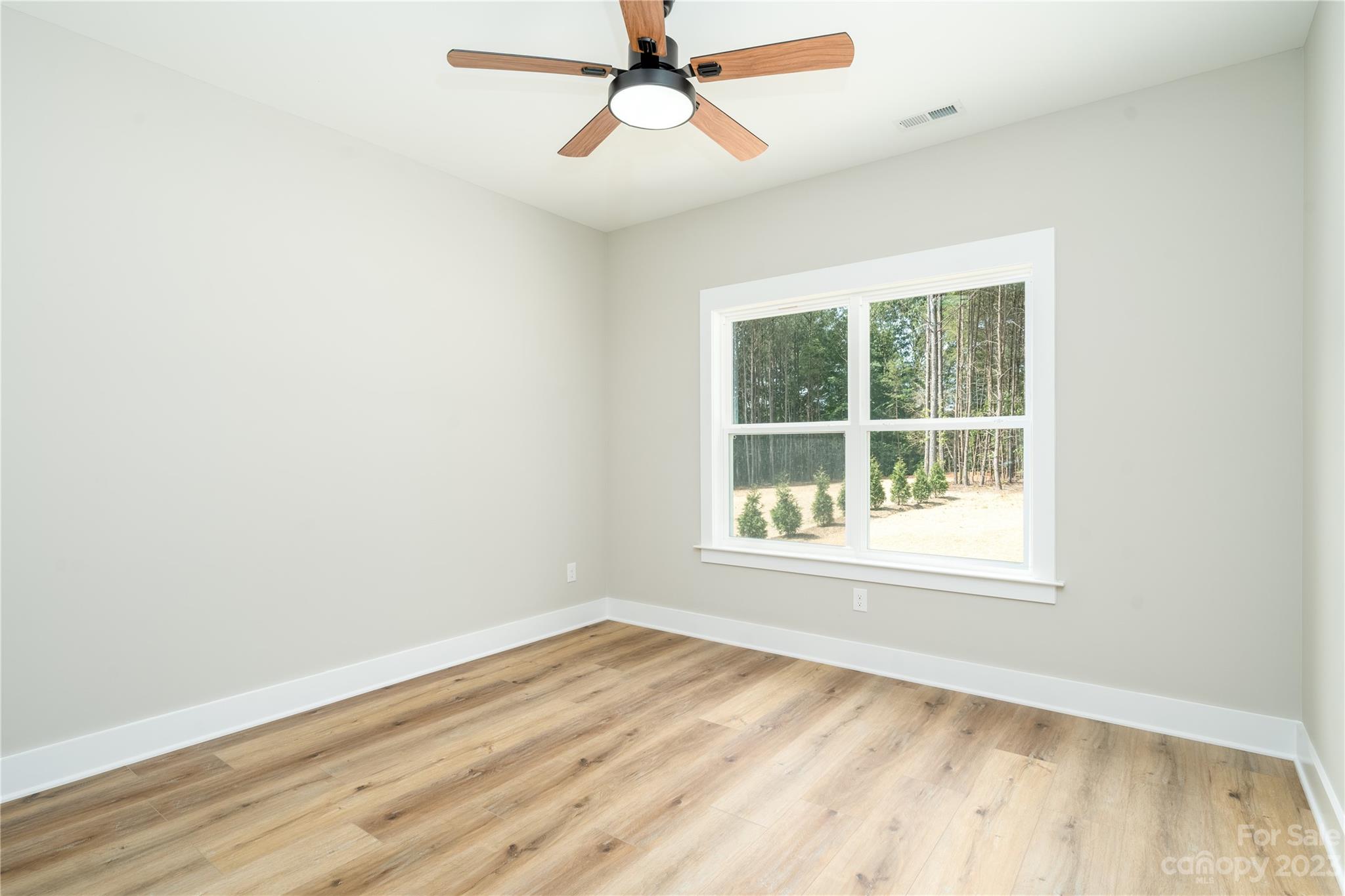 2512 Shuford Road, Unit 7A Lincolnton, NC 28092 - Photo 25 of 27 an empty room with a window and wooden floor