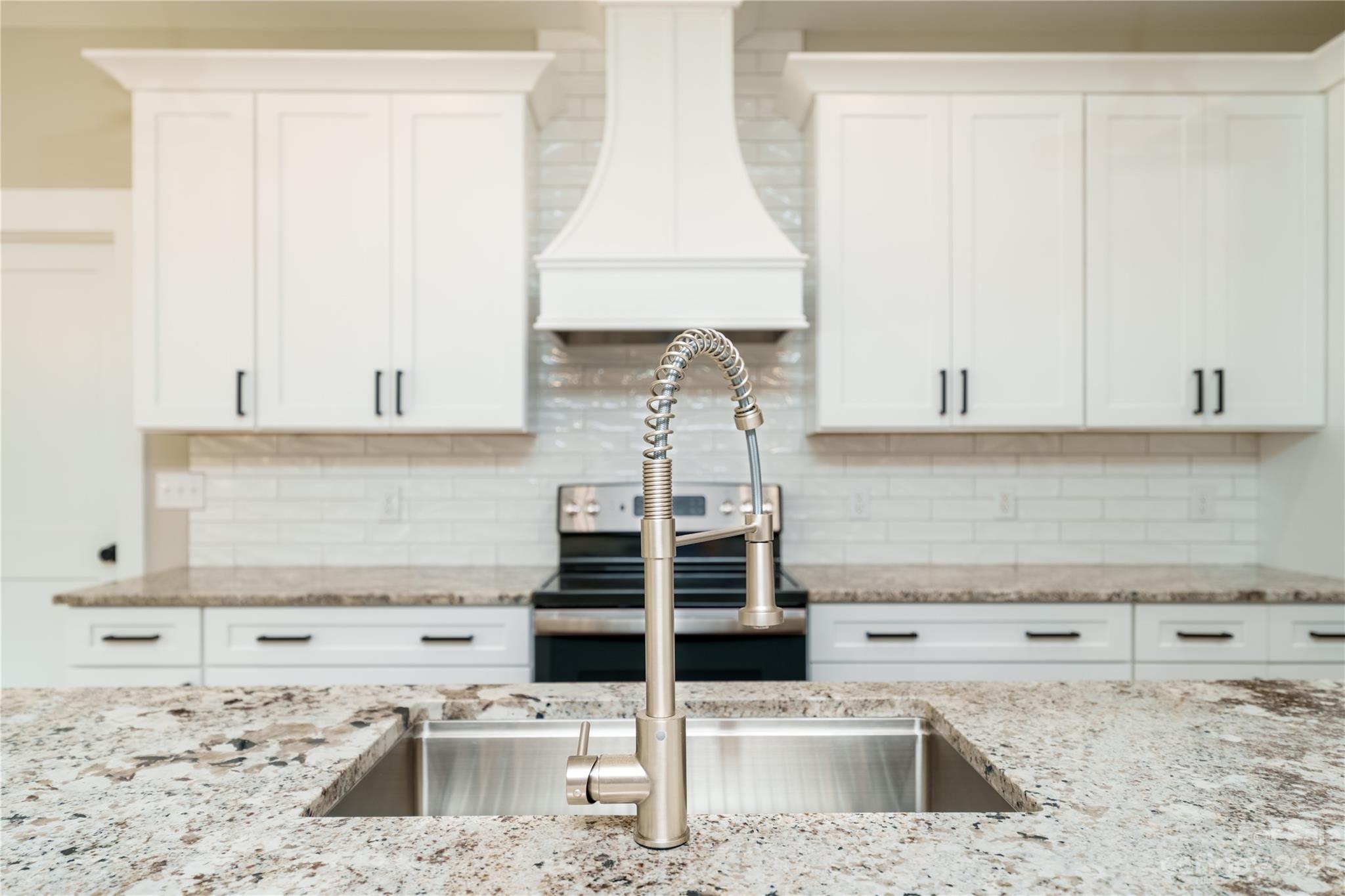 2512 Shuford Road, Unit 7A Lincolnton, NC 28092 - Photo 6 of 27 a kitchen with granite countertop a sink and a stove