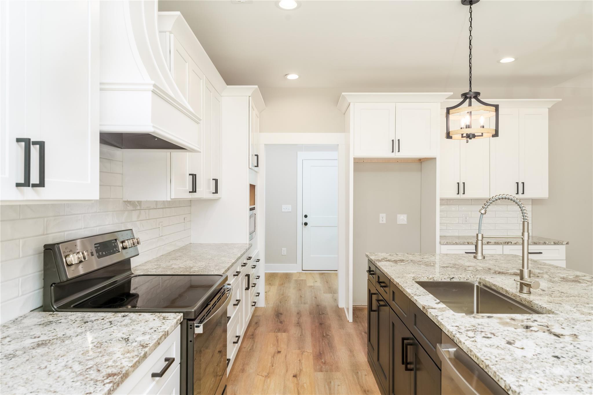 2512 Shuford Road, Unit 7A Lincolnton, NC 28092 - Photo 7 of 27 a kitchen with stainless steel appliances granite countertop a sink stove and refrigerator