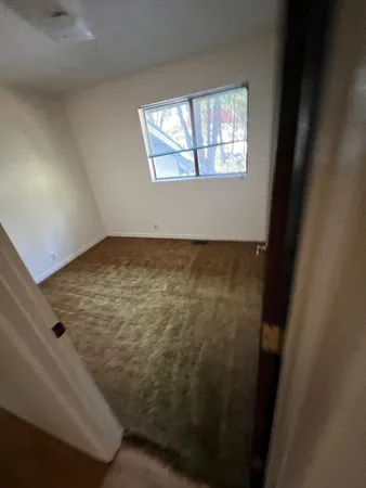 a view of an empty room and window