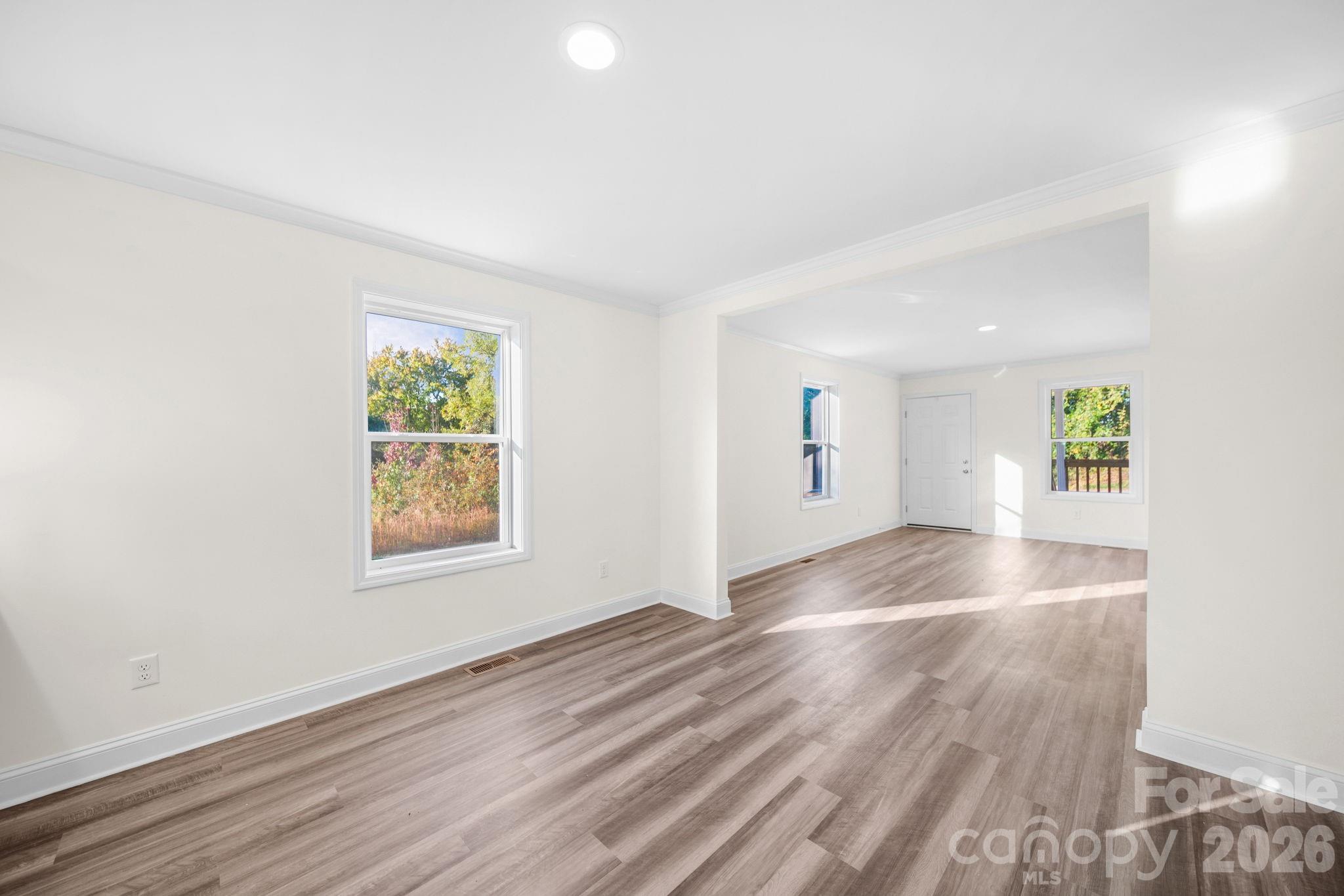 159 Hallman Street Cherryville, NC 28021 - Photo 12 of 37 an empty room with windows and entrance