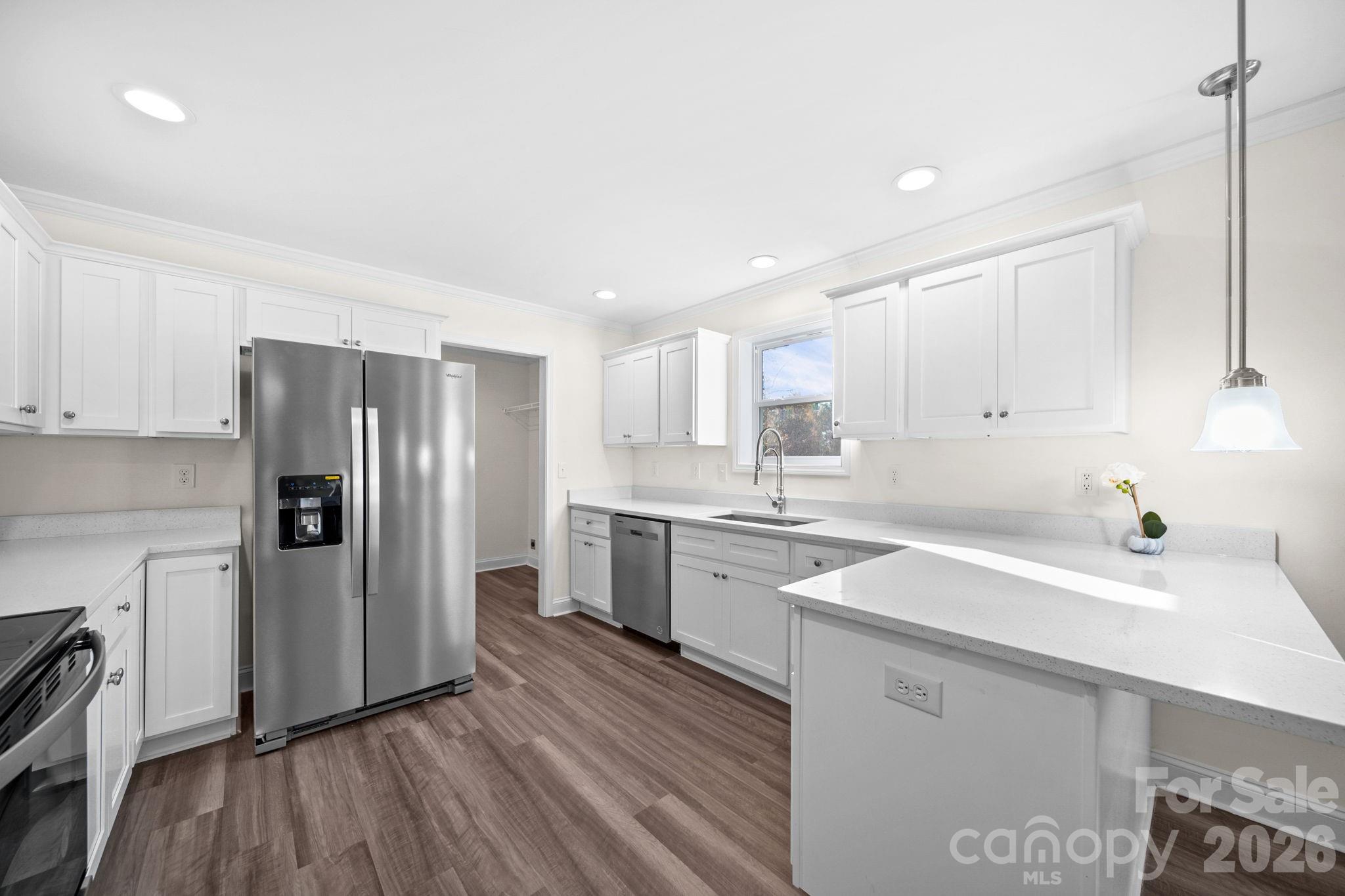 159 Hallman Street Cherryville, NC 28021 - Photo 14 of 37 a kitchen with a sink stainless steel appliances and cabinets