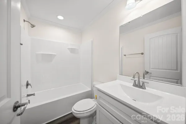 a bathroom with a sink a toilet and a bathtub