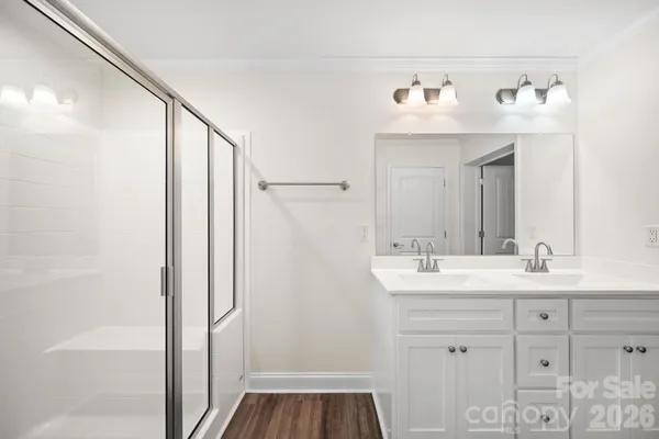 a bathroom with a sink vanity and a mirror