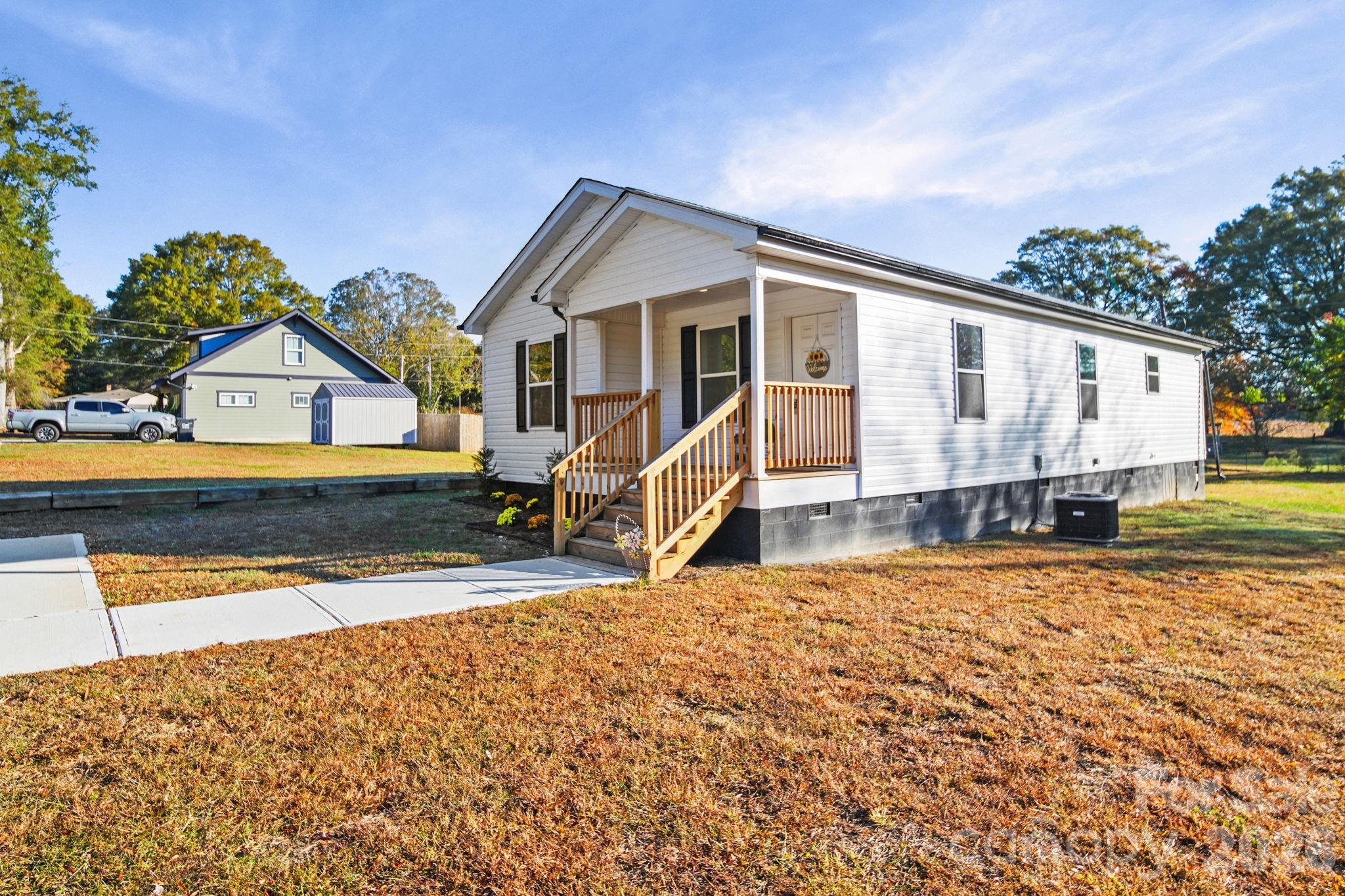 159 Hallman Street Cherryville, NC 28021 - Photo 6 of 37 a view of a house with wooden fence