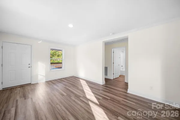 a view of an empty room and window