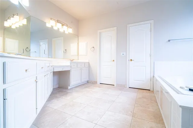 a view of a kitchen with cabinets