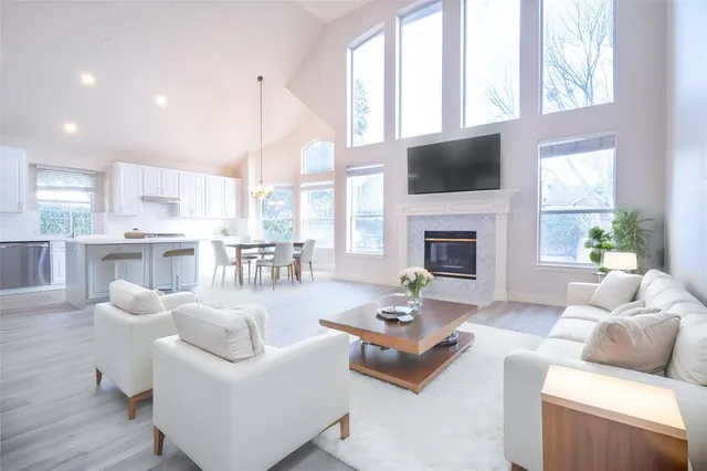 a living room with furniture fireplace and a flat screen tv