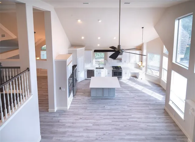 a view of a kitchen with a sink and a living room