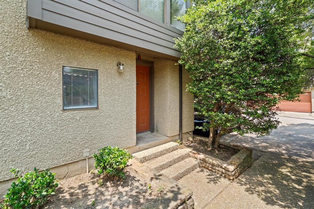 4543 North O'Connor Road, Unit 1247 Irving, TX 75062 - Photo 25 of 25 a front view of a house with a yard