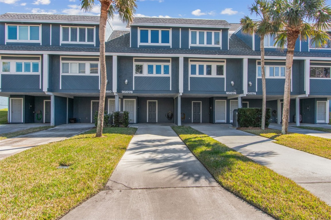95078 Sandpiper Loop Fernandina Beach, FL 32034 - Photo 1 of 38 a front view of a house with swimming pool