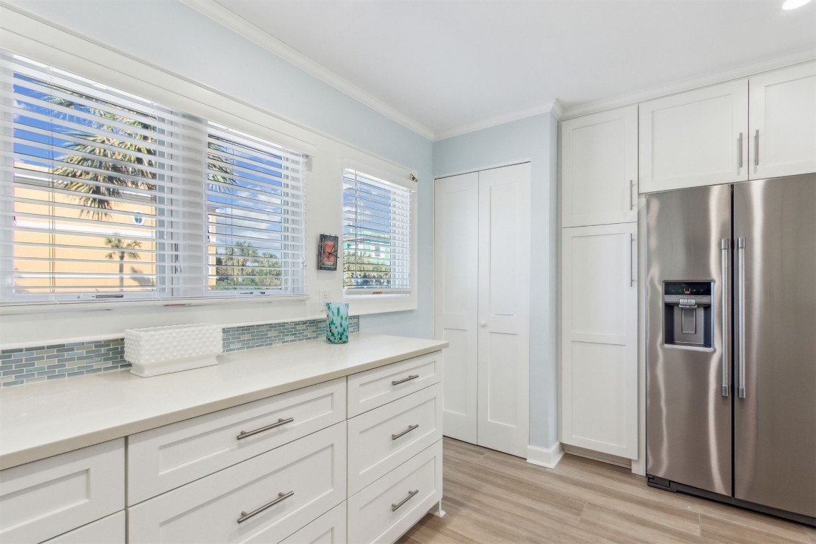 95078 Sandpiper Loop Fernandina Beach, FL 32034 - Photo 19 of 38 a kitchen with granite countertop cabinets stainless steel appliances a sink and a window