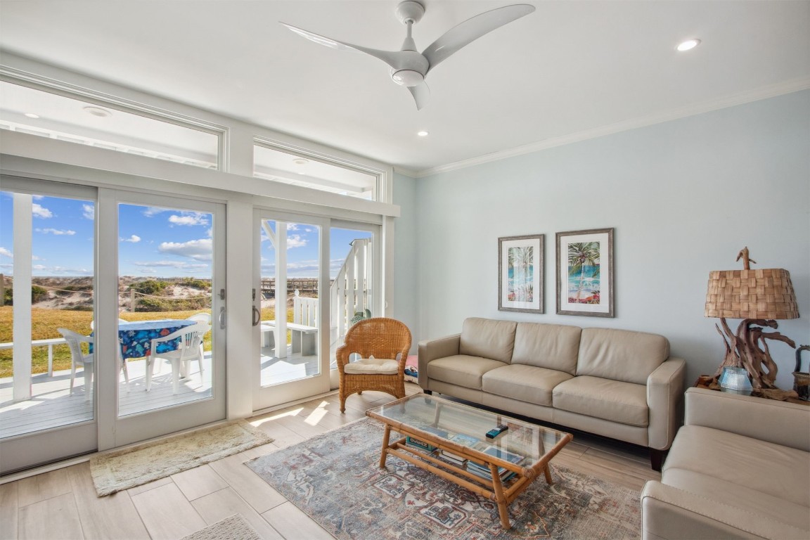 95078 Sandpiper Loop Fernandina Beach, FL 32034 - Photo 2 of 38 a living room with furniture and a floor to ceiling window
