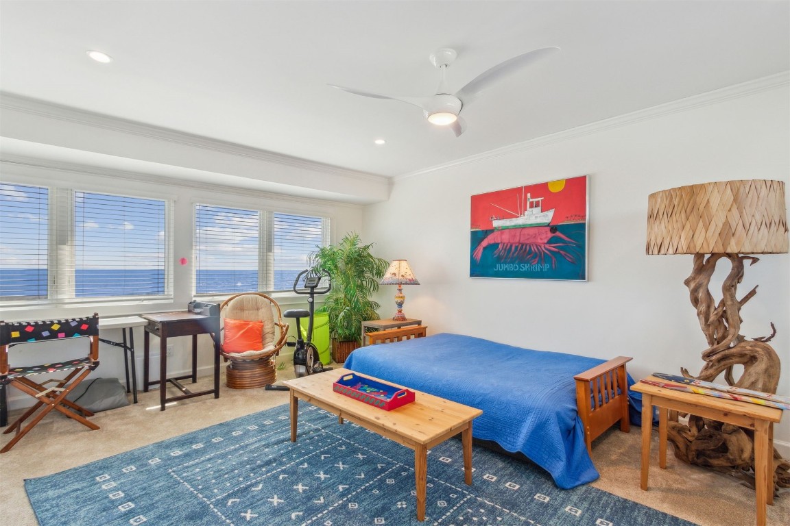 95078 Sandpiper Loop Fernandina Beach, FL 32034 - Photo 24 of 38 a living room with furniture a rug and a floor to ceiling window