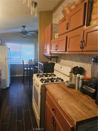 a kitchen with a stove and a refrigerator