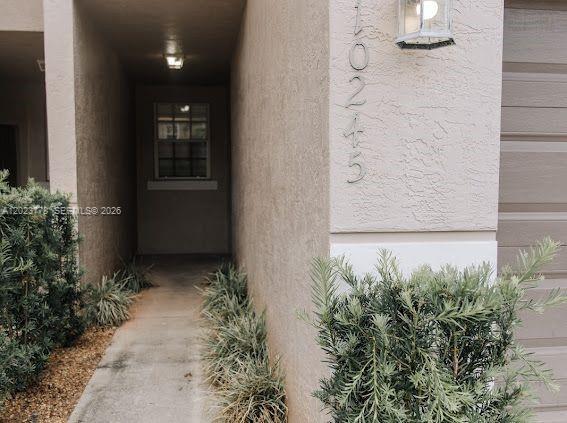 10245 Vía Hibiscus, Unit 10245 Boca Raton, FL 33428 - Photo 18 of 28 wooden floor with a potted plant in front of it