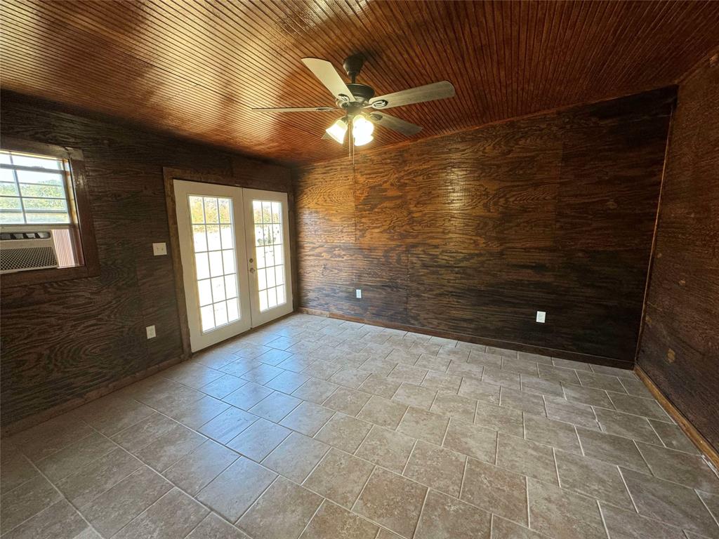 184 County Road Pattonville, TX 75468 - Photo 8 of 20 a view of an empty room with a window