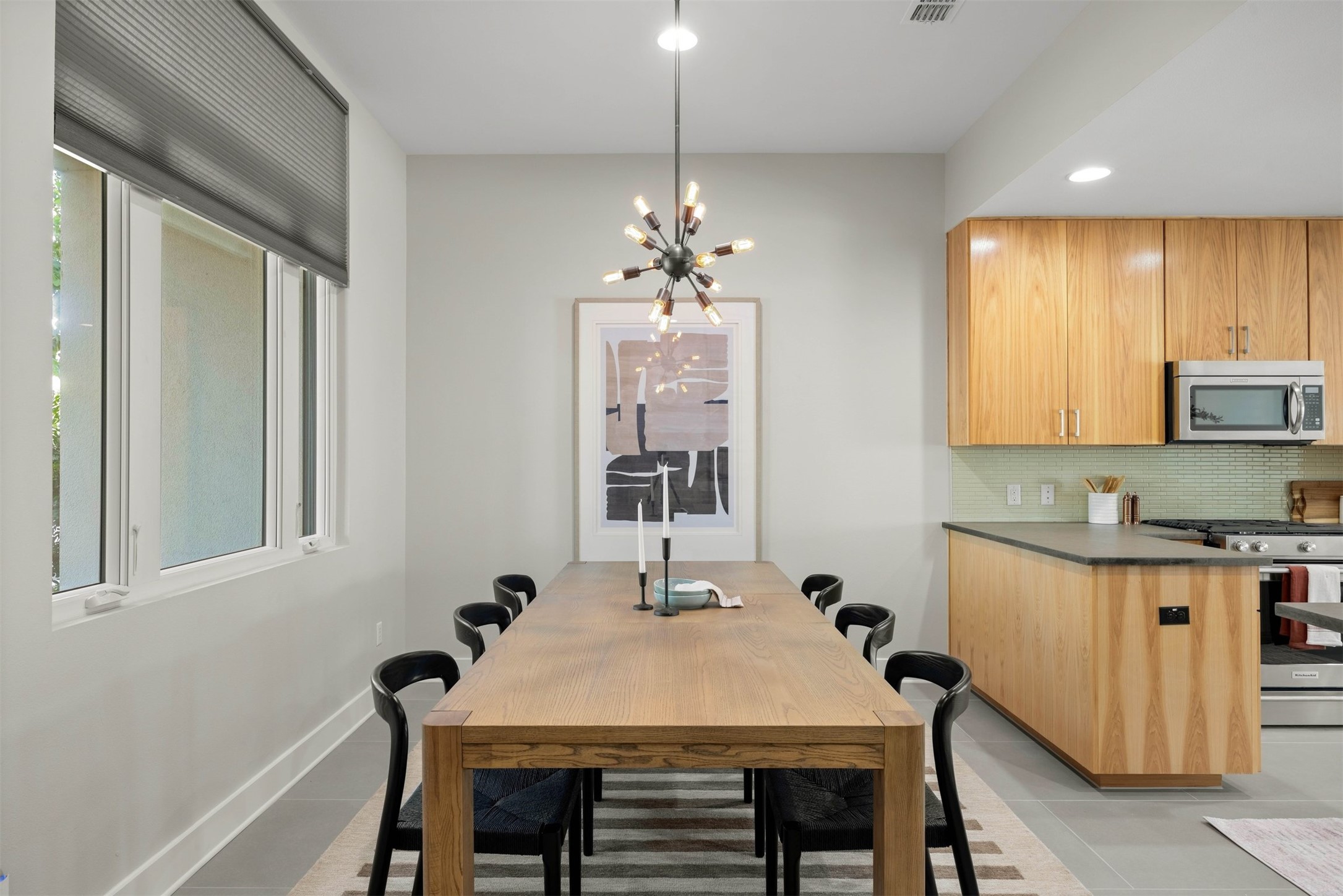 3921 Threadgill Street Austin, TX 78723 - Photo 11 of 36 Positioned just off the entryway, the dedicated dining area comfortably hosts weekend dinners with friends or quiet weekday breakfasts