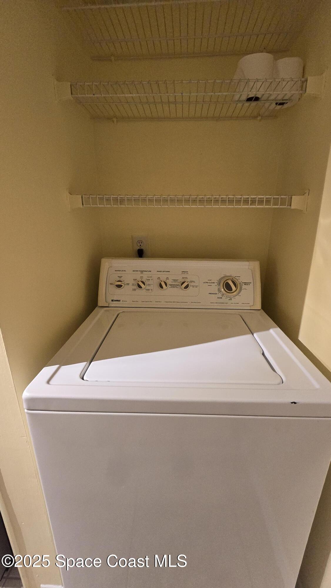 7667 North Wickham Road, Unit 1116 Melbourne, FL 32940 - Photo 11 of 34 a utility room with dryer and washer