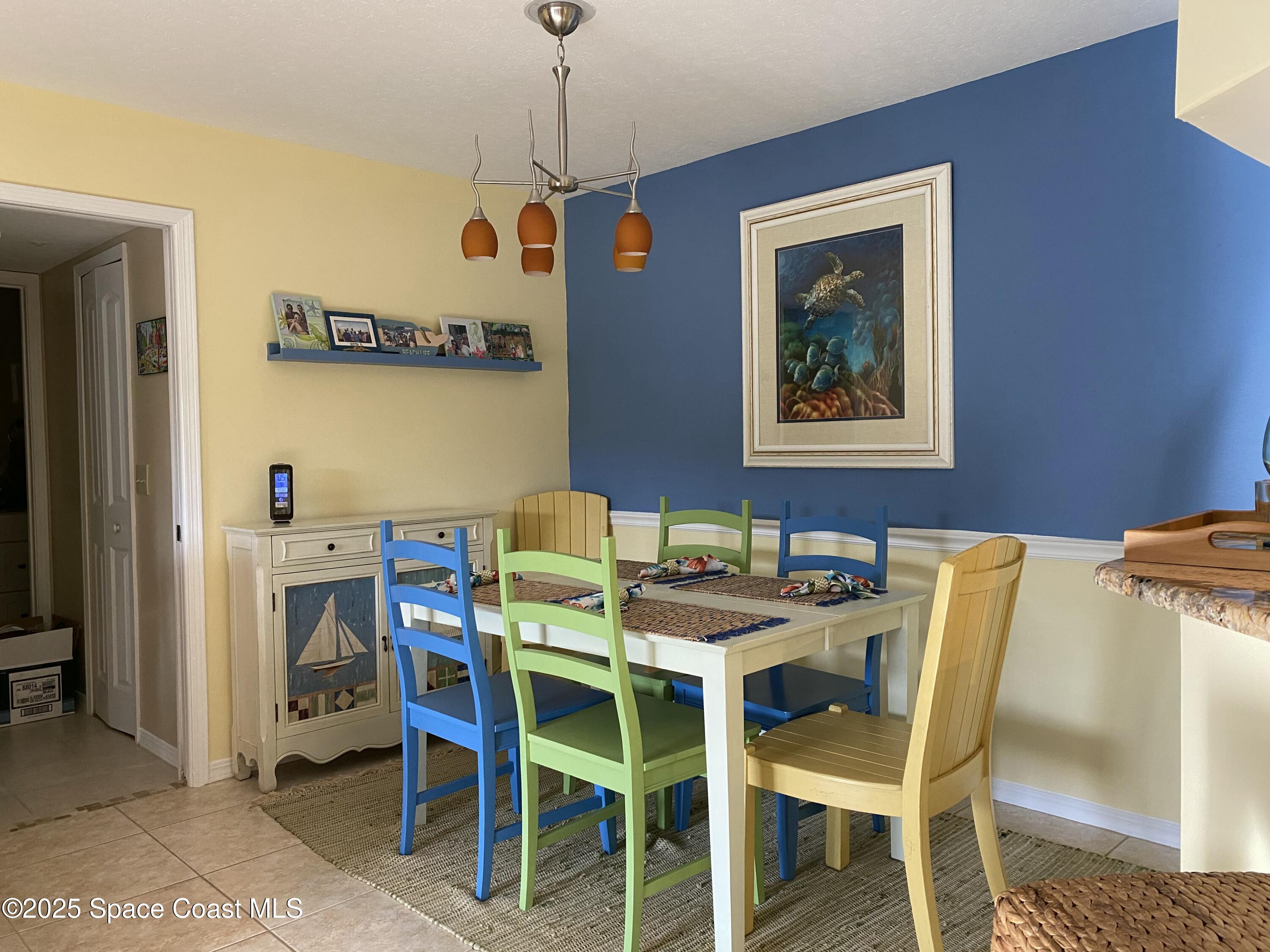 7667 North Wickham Road, Unit 1116 Melbourne, FL 32940 - Photo 13 of 34 a dining room with furniture and window