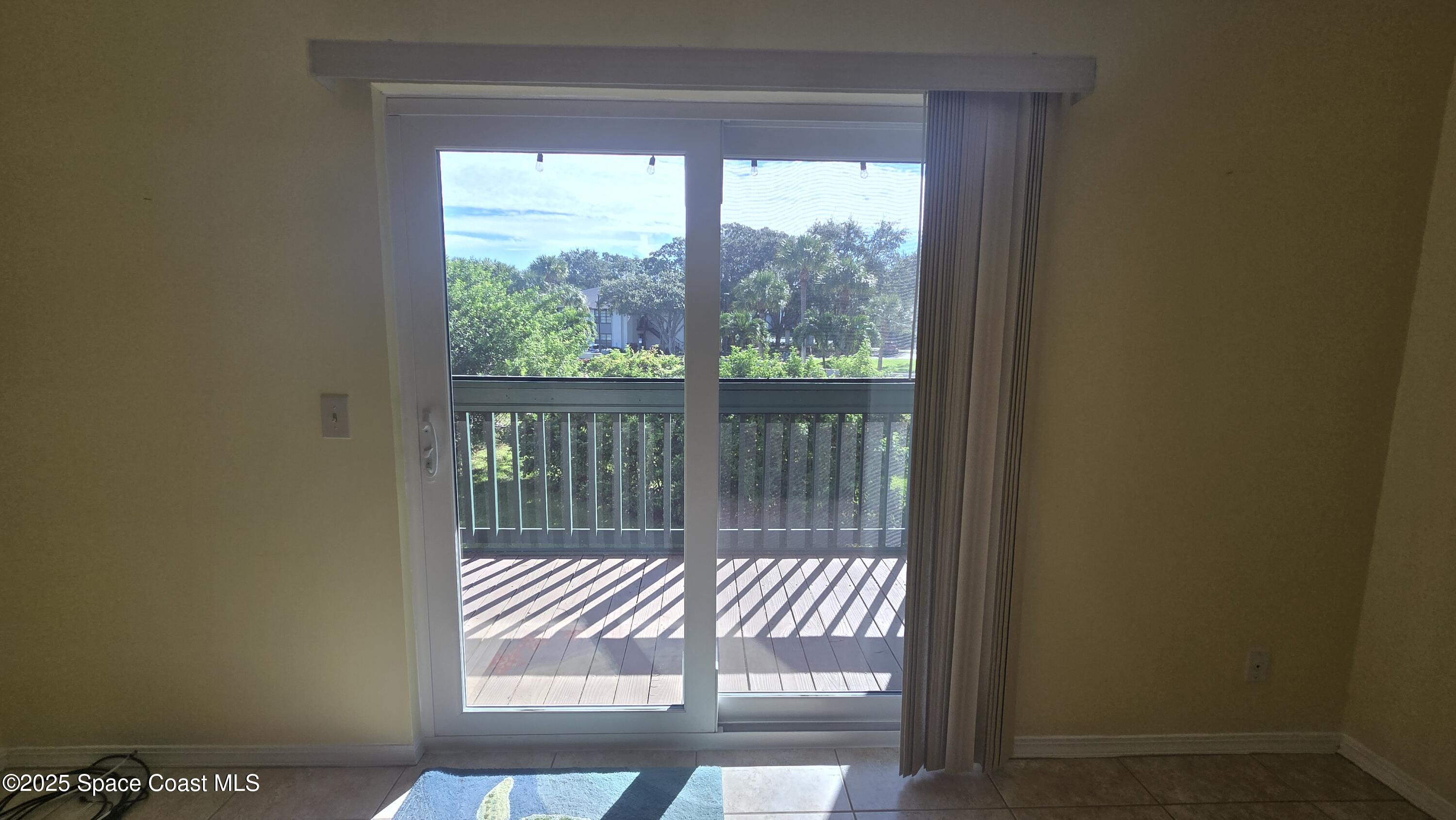 7667 North Wickham Road, Unit 1116 Melbourne, FL 32940 - Photo 17 of 34 a view of wooden floor and a window