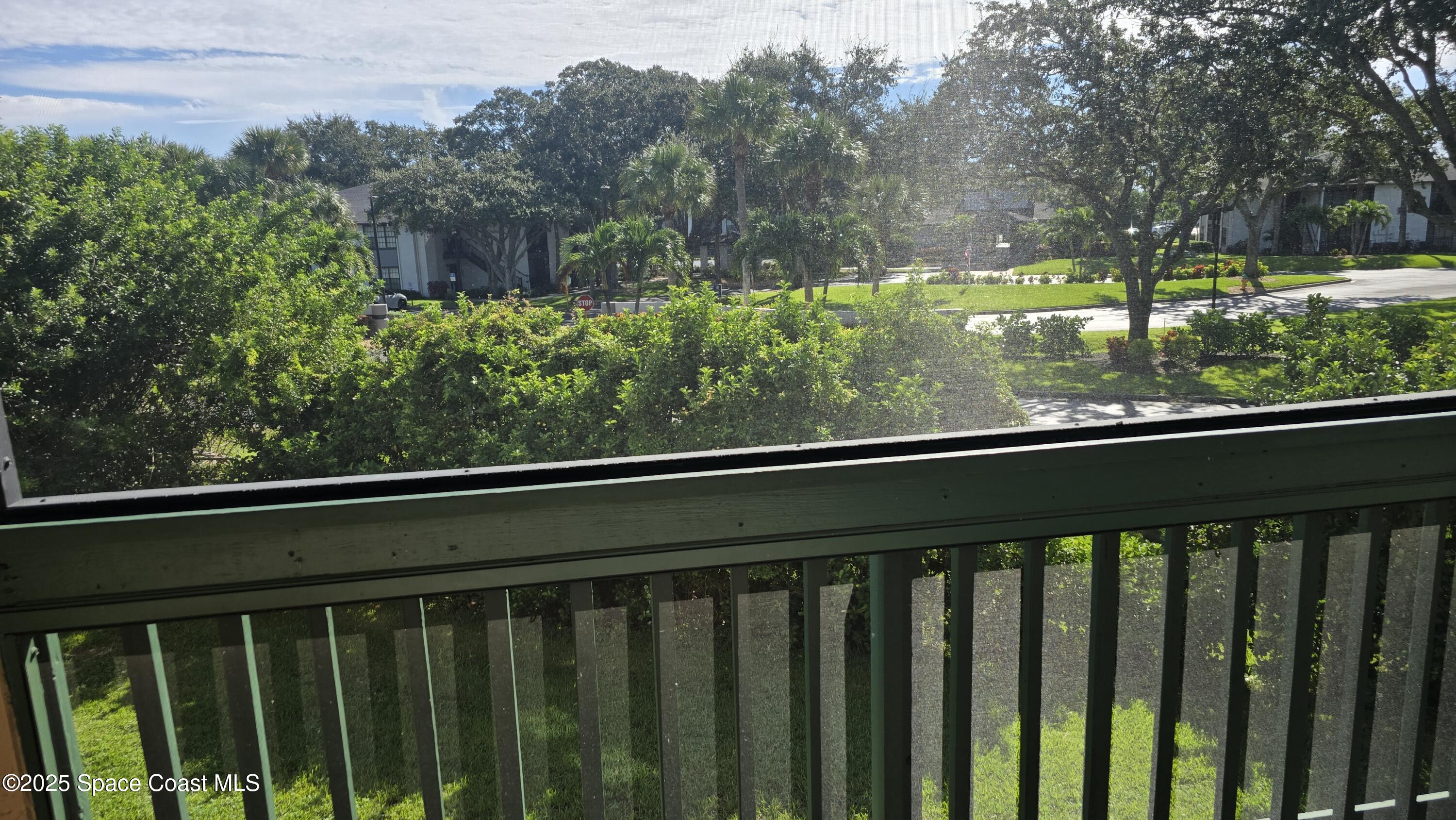 7667 North Wickham Road, Unit 1116 Melbourne, FL 32940 - Photo 19 of 34 a view of balcony with wooden floor