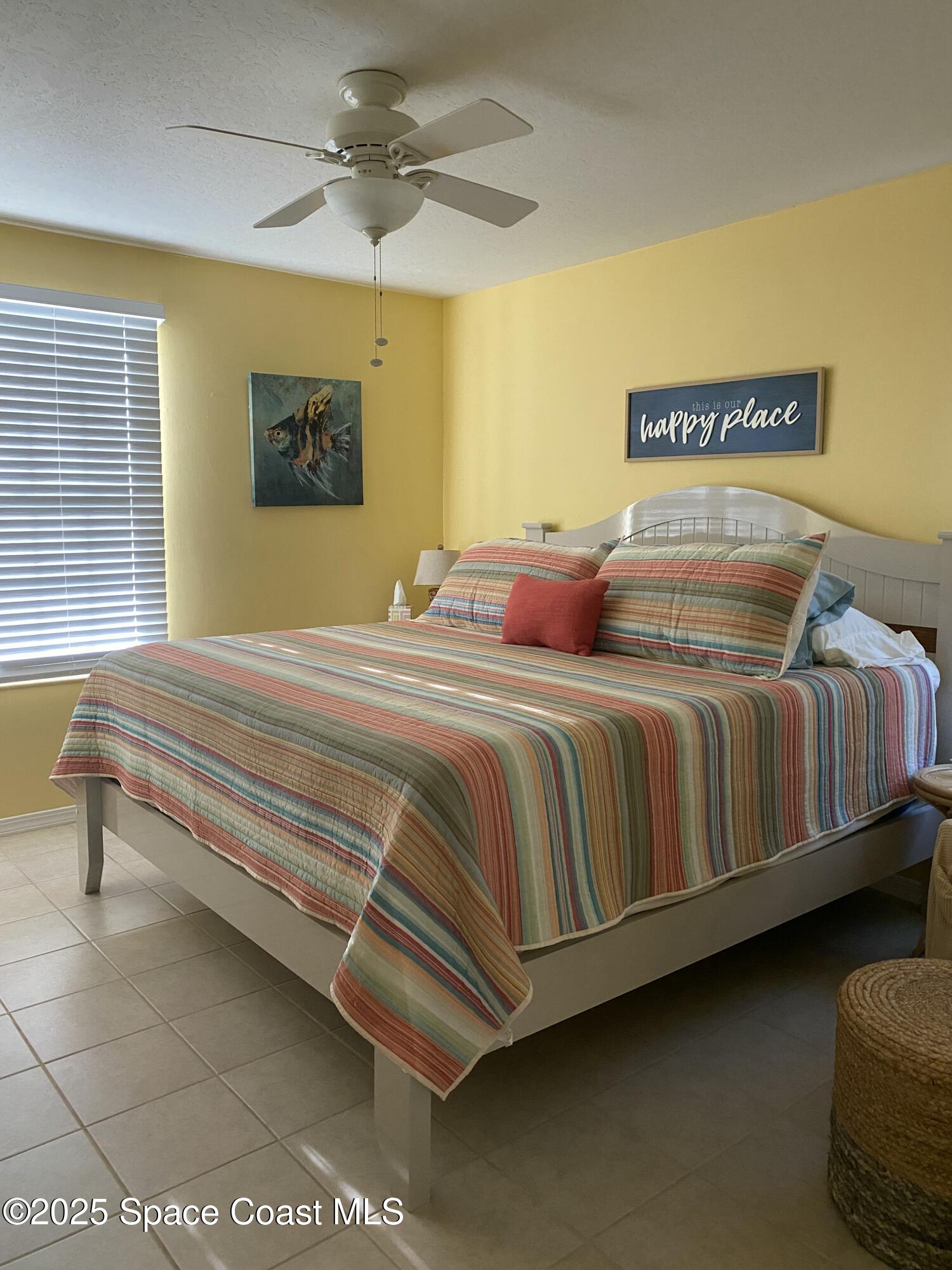 7667 North Wickham Road, Unit 1116 Melbourne, FL 32940 - Photo 25 of 34 a bedroom with a bed dresser and a window