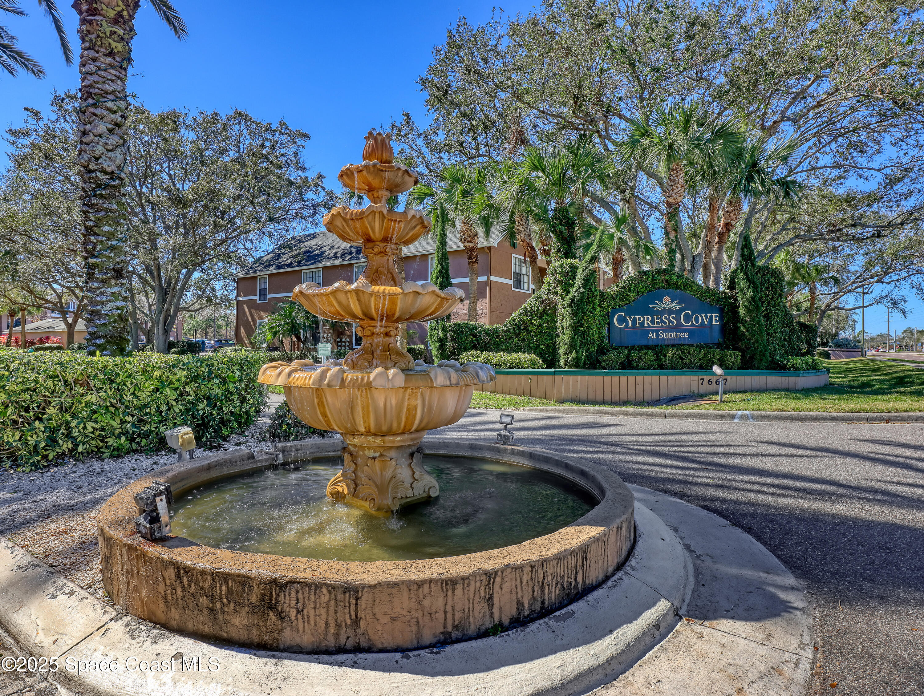 7667 North Wickham Road, Unit 1116 Melbourne, FL 32940 - Photo 30 of 34 a view of a fountain in the middle of a house