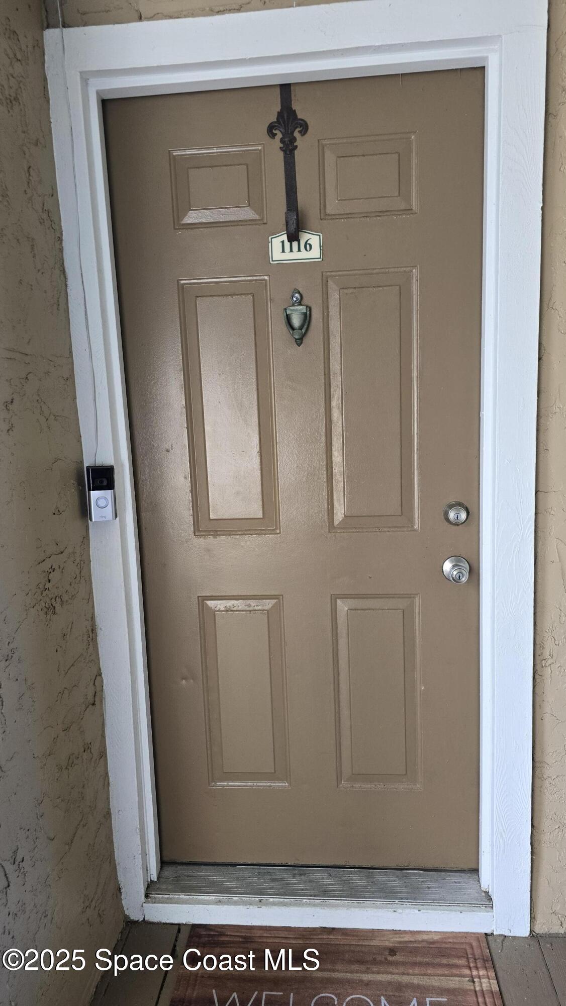 7667 North Wickham Road, Unit 1116 Melbourne, FL 32940 - Photo 4 of 34 a view of a door