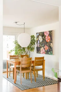 a living room with furniture and a rug