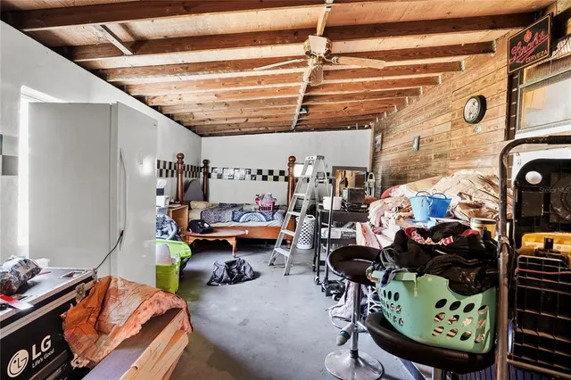 a utility room with lots of furniture and clutter