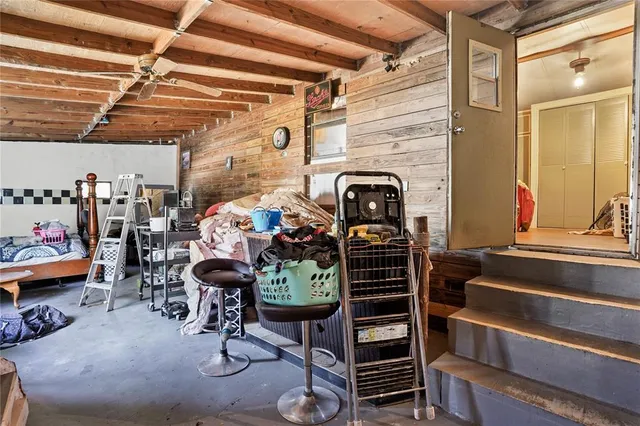 a view of entryway with workspace and stairs