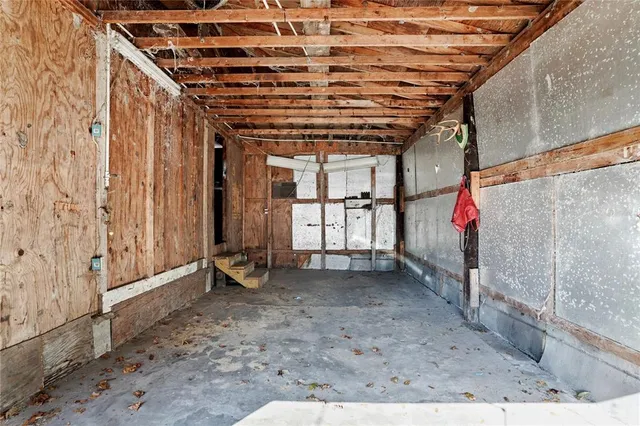 a view of a room with wooden walls