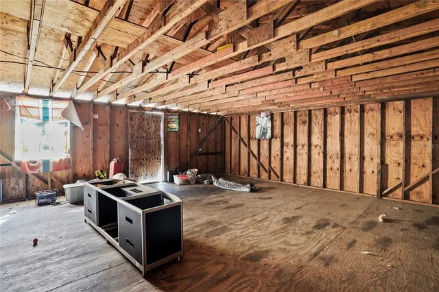 a view of a room with furniture and a window