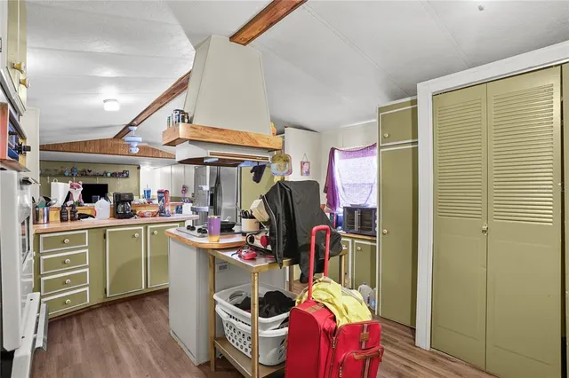 a view of a kitchen and utility room