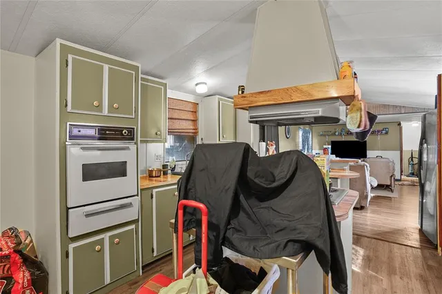 a view of kitchen and dining room with wooden floor