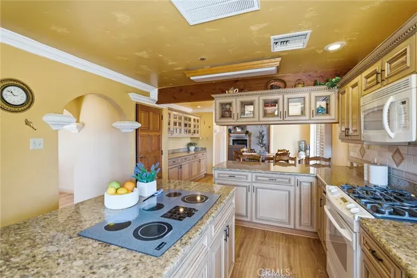 a fireplace with stainless steel appliances a stove top oven and a fireplace