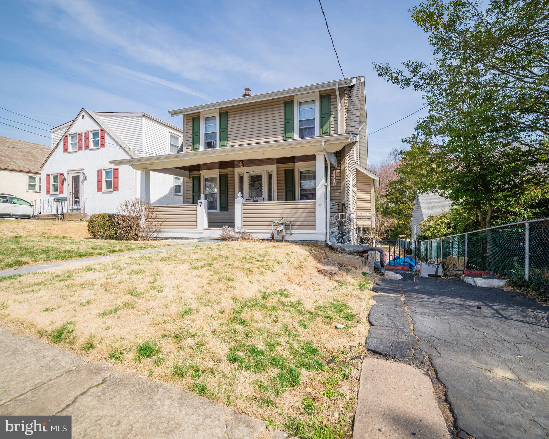7 Chestnut Parkway Wallingford, PA 19086 - Photo 2 of 50 a front view of a house with a yard